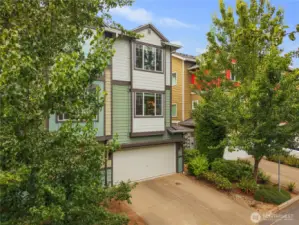 Back of the townhome with garage/driveway