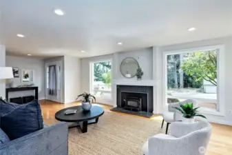 Living room and wood fireplace.  Check out the large windows