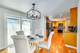 Long view of the dining room and kitchen