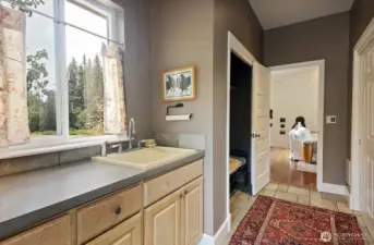 Upon entering, utility sink and work space along with double closets. 1/2 bath is to the right (just beyond right edge of photo).