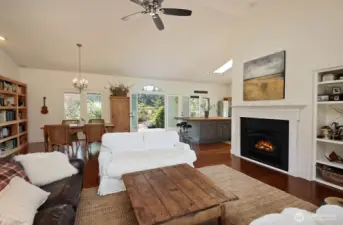 Propane fireplace with built-ins to the right of the fireplace.  Your back is to the stairwell that leads to the lower level with 2 more bedrooms, guest room, 3/4 bath and flex space.
