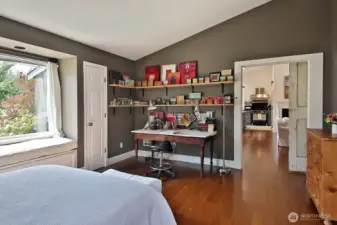 Looking back from the Primary in to the main living area. Sweet window seat to take in your pastoral views.