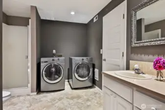 Lower level 3/4 bath includes the laundry area. Linen closets at your back.