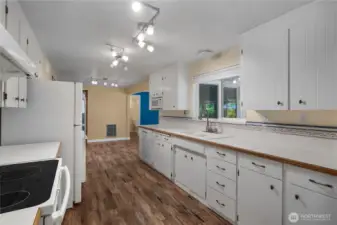 Kitchen features ample storage throughout and a window above the sink that offers a clear view of the backyard.