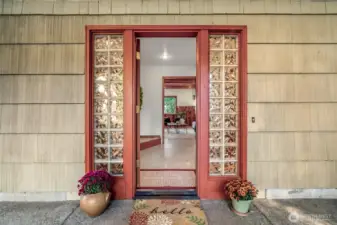 A welcoming front door opens to a large mudroom that connects easily to the family room and kitchen.