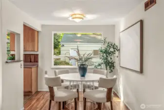 Dining Room connected to the Living Room. Original hardwood floors have been refinished and gleam.