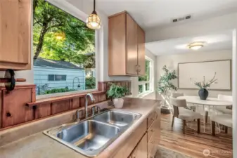 The large picture window overlooking the patio and backyard makes kitchen work a delight.