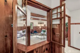 Pass-through with beautiful wood doors opens to the family room. This home is full of character and timeless period touches!
