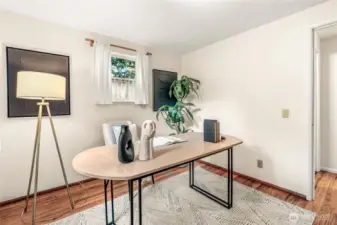 Back bedroom downstairs with windows on 2 walls. Perfect for an office.