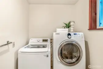 Washer/Dryer in the half bath/utility room on the ground floor just off the back entrance.