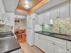 Beautiful kitchen with Granite counters and tiled backsplash. Double drop in stainless sink. All water fixtures have been updated!