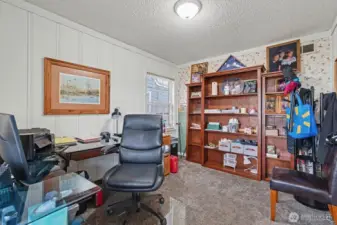 Main Floor Home Den / Office. Carpeted.