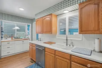 Stainless Steel Appliances. Tile Backsplash. Solid Surface Counters.