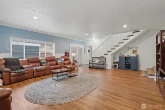Family Room with Access to Patio and Stairway to 2nd Floor.