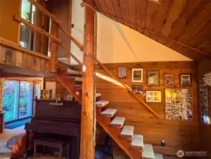 Stairway with hand hewn handrails.