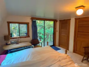 Another view of the upper bedroom and outside natural green beauty that is all around.