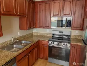 Well-appointed kitchen offering ample counter space and timeless finishes.