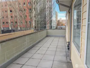 Expansive patio showcasing urban outdoor living rarely found in downtown condominiums.