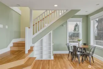 Daylight lower level with private entry, oak floors, and flexible space for guests or media room.