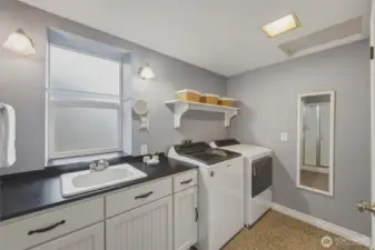 Convenient ¾ bath with washer and dryer located just off the daylight lower-level living space.