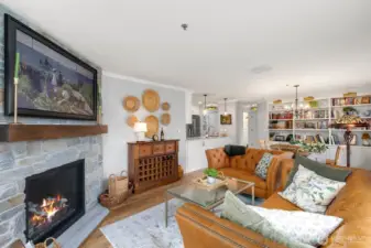 Living room with dining space and open kitchen.