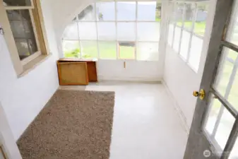 Bright and sunny covered entrway/sun porch. *Images from before current tenancy - home is a fixer*.