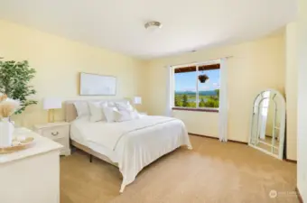 The primary bedroom faces the lake and mountain views and is expansive.