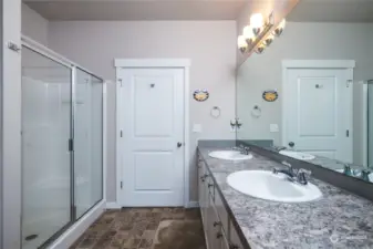 You will love all of the primary bathroom counter space and cabinetry!