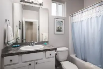 The main bath is conveniently located near the second and third baths and mudroom.