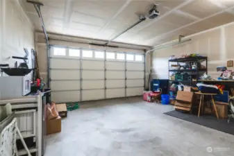 The oversized garage offers natural light through the windows and plenty of room for household storage.