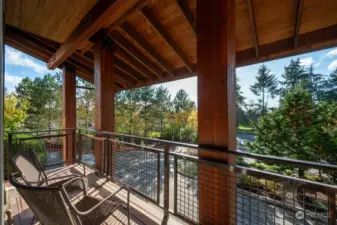 Composite decking material and the amazing craftsman style adorning your one of a kind deck with partial views of the golf course and sound.  The waterfall feature out front is a nice view as well.  Gas is plumbed on the deck for your private BBQ.  There is also a community BBQ station in the courtyard for all residents to share if you prefer.