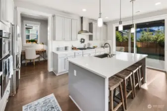 Kitchen leads to home office, huge pantry and mud room