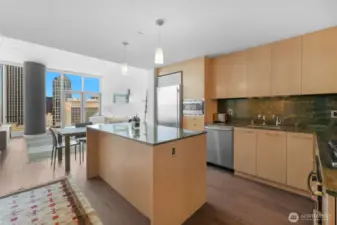 Modern kitchen with high end appliances including Subzero fridge.