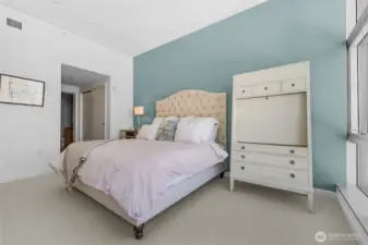 King sized primary bedroom with views