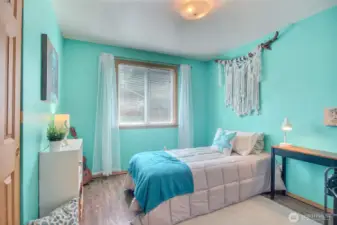 The second of the two bedrooms is also light and bright, and located directly across from the hallway bathroom