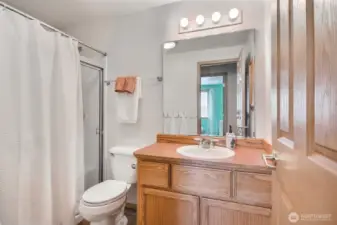 In the secondary bathroom you'll find a spacious walk-in shower for easy access.