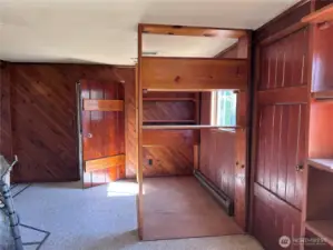 Behind fireplace - built in bookcases - possible office