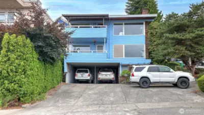Incredible investment opportunity in the heart of Queen Anne — a rare triplex offering iconic views of the Space Needle, skyline & water. Please do not disturb tenants; showings by appt only. Each unit offers a cozy wood fireplace, w/Units 1 & 2 offering private decks to take in the stunning views. Unit 1 & its replica, Unit 2, are spacious 2-bed/1-bath layouts w/carpet/vinyl flooring & fully equipped kitchens. Unit 3 is a charming 1-bed, 1-bath w/hardwood floors in the living rm & vinyl in the kitchen. The property has 3 separate meters, baseboard heating throughout & on-site coin laundry. Whether you're looking to live in one unit & rent the others or expand your rental portfolio, this triplex delivers both location & long-term potential.