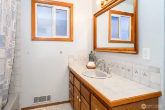 Full main bath is adjacent to bedrooms