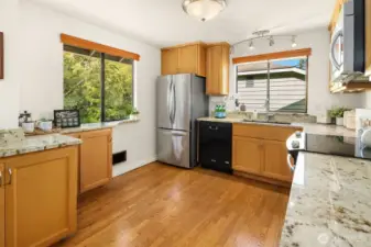 Granite countertops and natural light make this a wonderful kitchen space