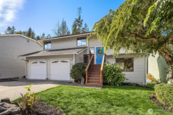 Large 2 car garage with driveway parking space and street parking