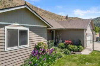 Lots of seasonal flowers and shrubs in both the front and back yards. Small fenced area in the front yard to keep critters safe.
