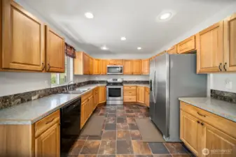 Large kitchen with lots of cabinets and countertops. All kitchen appliances are included with sale.