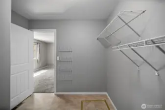 Walk-in closet in the primary bedroom.