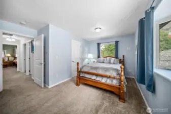 2nd bedroom with walk-in closet to the left. Furniture has been moved out.