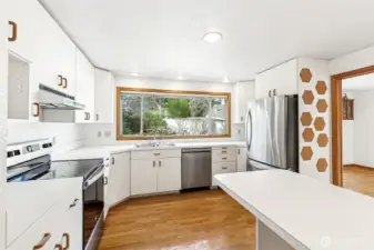 Another view of the kitchen with entrances off the hallway and dining room