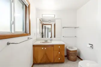 The primary bath is a half bath, but the "closet" was likely a shower originally. The two upper level bathrooms back up to each other, so there is room and plumbing for a full bathroom here.