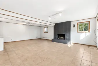 Downstairs Rec room. This fireplace is wood burning and functional