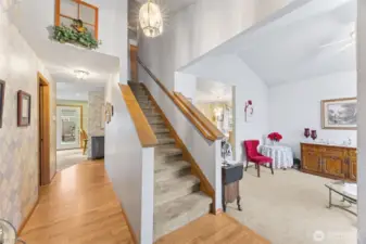 Lovely entry way with hardwood floors, bright lighting and vaulted ceilings in both entry & formal living areas.