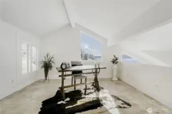 Beautiful bedroom loft staged as an office.